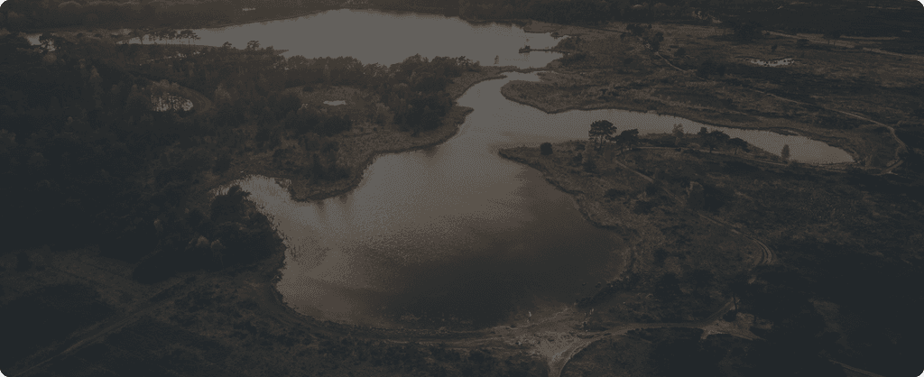 Aerial of a watershed and surrounding terrain at scale.